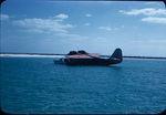 A boat near a floating seaplane off the coast of North Cat Cay