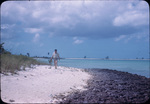 A man walking along the beach on Andros, Bahamas