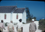 Four men walk towards a church on Staniard Creek, Andros, Bahamas