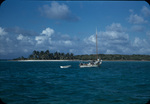 A sailboat pulling a row boat near Mangrove Cay, Andros, Bahamas