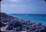 View of boater from coral coastline of New Providence, Bahamas
