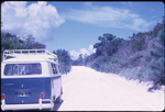 A Volkswagen bus parked on dirt road on Treasure Cay