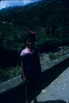 A school girl standing on the road side in Moore Town, Portland, Jamaica