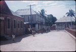 A dirt road and buildings in Spanish Town, Saint Catherine, Jamaica