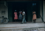 People standing outside the Central Drug Store in Ocho Rios