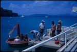 Tourists gathered on the dock near the Caneel Bay Hotel