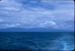 View of distance mountains from the ocean off the coast of Saint Vincent