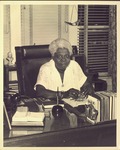 Mary McLeod Bethune poses at her desk in Foundation