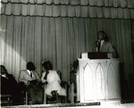 Male speaker at an assembly
