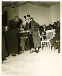 Mary McLeod Bethune awards a plaque to Henry Bartley