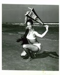 Female student holds a Bethune-Cookman pennant