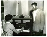 Student William Small with a telephone operator