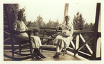 Photograph of Alice Ellen and Clara Louise Guild on the porch of their Summer home in New Hampshire.