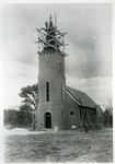 Brick church construction. 1938-39. Workmen on top of bell tower.