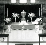 Altar and chancel of the 1939 brick church, Holy Week, c. 1940