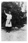 Young Katie Mikler in Orange Grove on Mikler Road, c. 1920