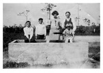 Young Paul and Steve Mikler with Katie, John Duda and young Anna Mikler at water trough, c. 1920s