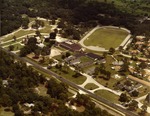Aerial views of the construction of Founders Hall and new track, c. 1978, and of campus after completion of the project, c.1980.