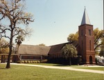 Exterior views of 1957 brick church, showing north transept