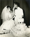Wedding, June 14, 1959. Cutting of the cake on the stage of St. Luke's School Auditorium