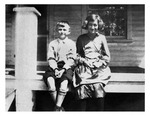 Young Paul Lukas, Jr. and sister Mary on porch of their home, c.1920, Black and White