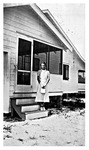 Elizabeth Mikler on steps of the Michael Mikler home. 1930s., Black and White