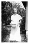 Elizabeth Mikler, carrying a pot. 1930s., Black and White