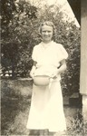 Elizabeth Mikler, carrying a pot. 1930s., Original