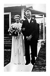 Elizabeth Mikler and escort exit wood church after Tesinsky wedding, August 21,1938., Black and White