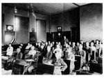 Oviedo School Classroom, c.1912. Slavia student, John Duda, is seated near windows, Black and White