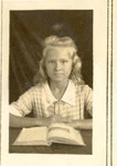 Elizabeth Mikler with textbook in classroom at Oviedo School, c.1928, Original