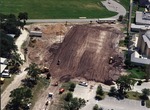 Three views of site preparation for new school. 2000