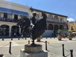 Girl on a Rooster Statue