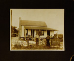 Parents and Children Standing in Front of House