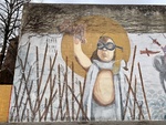 Mural of Young Boy with Goggles, Leather Helmet, and Toy Airplane, Luján, Buenos Aires