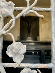 View of Crucufix and Coffin Through Window With Bronze Grille Featuring Floral Design. Recoleta Cemetery. 2 by Wendy Howard