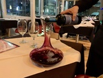 Pouring Wine at a Restaurant in Puerto Madero, Buenos Aires by Wendy Howard