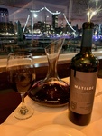 Wine and Glassware at a Restaurant with Evening View of Puerto Madero, Buenos Aires 1 by Wendy Howard