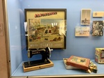 Artifacts Associated with Evita Perón: Toys, Small Sewing Machine, and Photo of Evita with Children. Evita House, Buenos Aires 1 by Wendy Howard