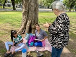 Students gather in Parque Los Andes in Buenos Aires for outdoor learning and discussion during a sunny afternoon by Wendy Howard