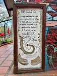 Visit to the Santuario del Gauchito Gil in Parque Los Andes with a decorative sign and local art by Wendy Howard