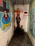 Visitors pay their respects at the Santuario del Gauchito Gil in Parque Los Andes, Argentina, during a busy day filled with activity by Wendy Howard
