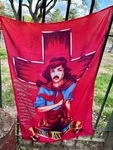 Visit to Santuario del Gauchito Gil in Parque Los Andes shows a vibrant flag representing Gauchito Gil by Wendy Howard