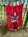 Colorful banner of Gauchito Gil displayed at Santuario del Gauchito Gil in Parque Los Andes, Argentina, showcasing cultural significance by Wendy Howard