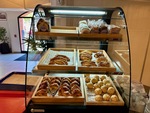 Selection of baked goods displayed in the food court of Edificio San Alberto Magno at Universidad Catolica Argentina in Buenos Aires by Wendy Howard
