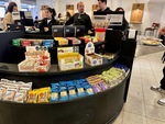 Cafeteria scene at Edificio San Alberto Magno in Puerto Madero, Buenos Aires, featuring students and a variety of snacks available by Wendy Howard