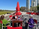 Lunch at a restaurant by Laguna de los Coipos in Puerto Madero, Buenos Aires, during lunchtime with friends by Wendy Howard