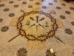Mosaic floor design featuring arrows and a crown at Edificio San Alberto Magno in Buenos Aires by Wendy Howard