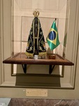 Statue and flag displayed in the cathedral at Edificio San Alberto Magno in Buenos Aires, Puerto Madero by Wendy Howard