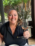 Cheers to a delightful wine tasting experience at Lamadrid Estate Wines in Mendoza, Argentina with a glass in hand by Wendy Howard